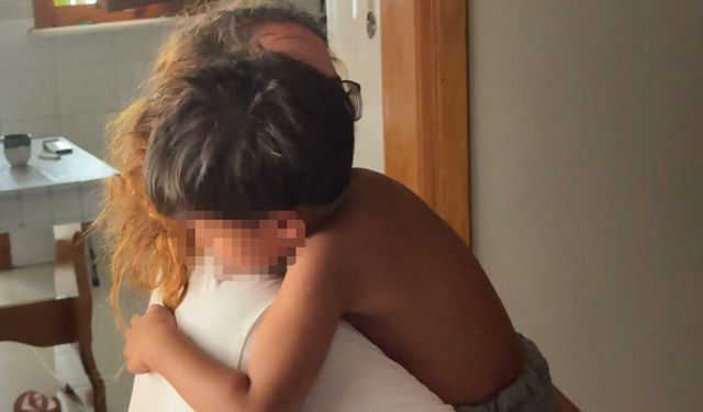 İtfaiye başı demir kapıya sıkışan çocuğu kurtardı