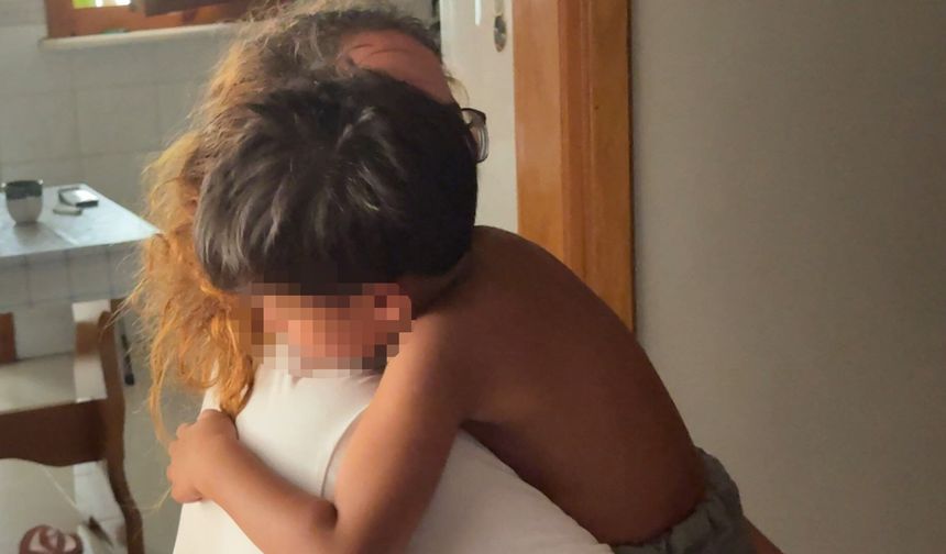 İtfaiye başı demir kapıya sıkışan çocuğu kurtardı